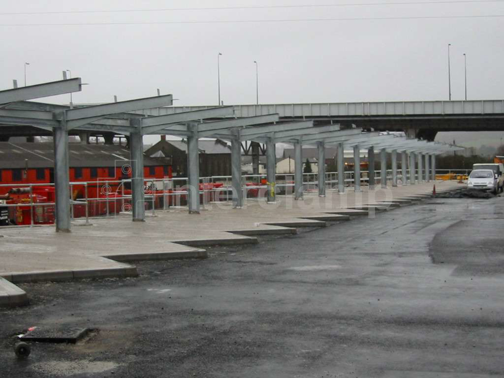 Interclamp pipe clamp fittings and tubes used to construct secure safety guardrailing at a civic amenity and recycling facility, ensuring a safe environment for visitors.